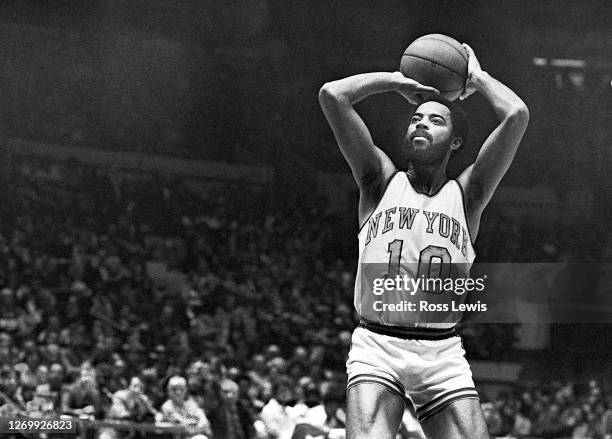 Walt Frazier, New York Knickerbockers guard, shoots the basketball during an NBA game against the Buffalo Braves at Madison Square Garden, New York...