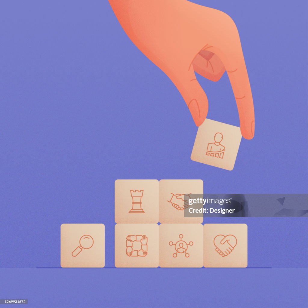 Hand Holding Wooden Cubes with Core Values Icons Concept.