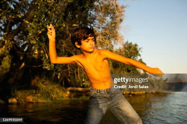 Kids Throwing Rocks Photos and Premium High Res Pictures - Getty Images