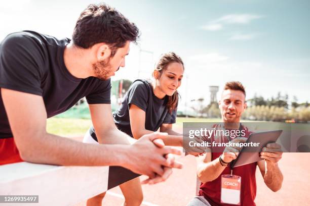 stretching before the obstacle road - sport tablet stock pictures, royalty-free photos & images