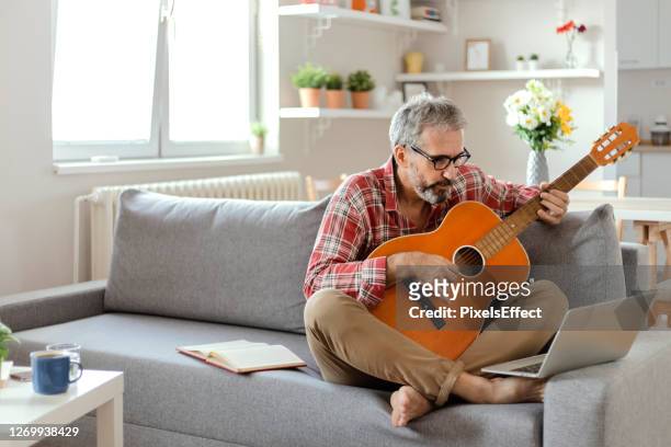 learning to play from web - practicing stock pictures, royalty-free photos & images