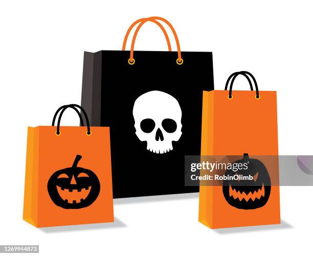 halloween shopping bags - scary pumpkin faces stock illustrations