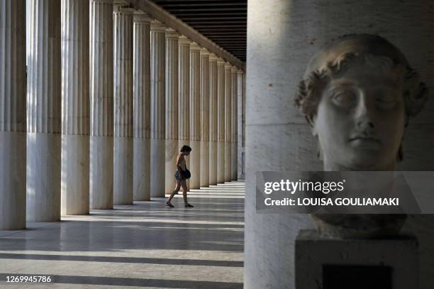 Tourist visits the 159-138 B.C Stoa of Attalos, a gift from the King of Pergamon Attalos II, at the Ancient Agora, in Athens, on August 13, 2010. AFP...