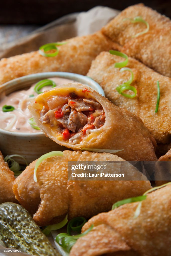 Philly Cheese Steak Egg Rolls with Onions and Roasted Red Peppers