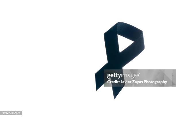 black ribbon on white background - melanoma awareness stock pictures, royalty-free photos & images