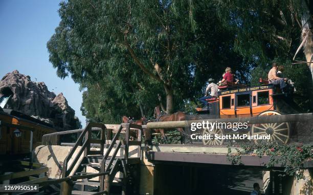 View of park goers taking a horse and carriage ride through 'Ghost Town' at Knott's Berry Farm, Buena Park, California, October 4, 1973.
