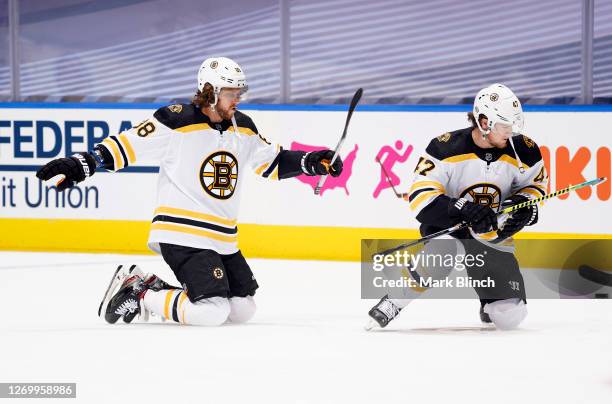 David Pastrnak and Torey Krug of the Boston Bruins warm up before Game Five of the Eastern Conference Second Round of the 2020 NHL Stanley Cup...
