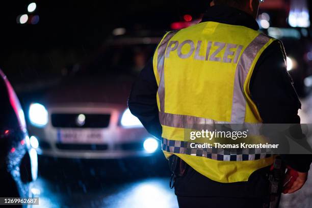 An Austrian police officer is seen on the Austrian-Hungarian boarder shortly after Hungary imposed a ban on the arrival of non-resident foreigners on...