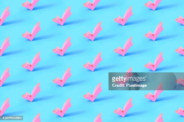 seamless repetitive check mark pattern on blue background - checklist concept stock pictures, royalty-free photos & images