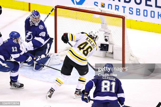 David Krejci of the Boston Bruins scores a tying goal past Andrei Vasilevskiy of the Tampa Bay Lightning during the third period in Game Five of the...
