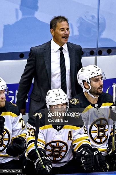 Head coach Bruce Cassidy of the Boston Bruins reacts against the Tampa Bay Lightning during the first overtime period in Game Five of the Eastern...
