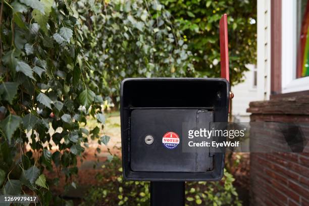 a mailbox outside a house with a "i voted today" sticker on it. - message box stock pictures, royalty-free photos & images
