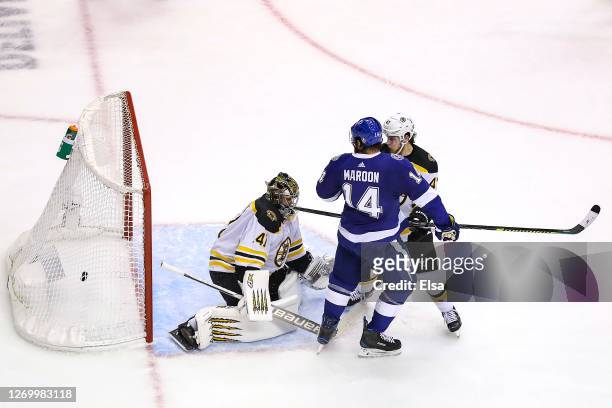 Pat Maroon of the Tampa Bay Lightning watches as the game-winning goal from teammate Victor Hedman , goes past Jaroslav Halak of the Boston Bruins...