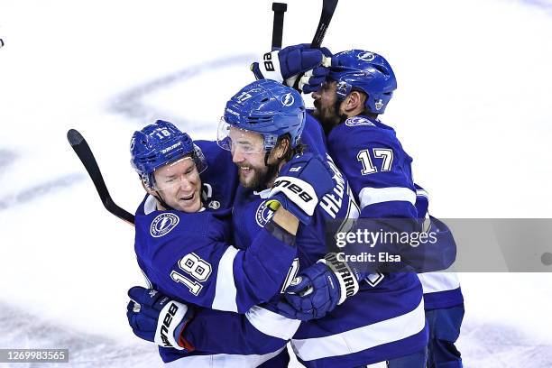 Victor Hedman of the Tampa Bay Lightning is congratulated by his teammates, Ondrej Palat, Alex Killorn after scoring the game-winning goal during the...