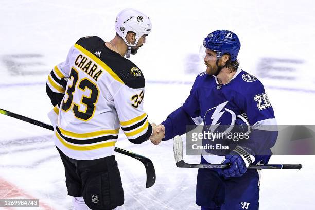 Blake Coleman of the Tampa Bay Lightning shakes hands with Zdeno Chara of the Boston Bruins after the Lightning's 3-2 victory during the second...