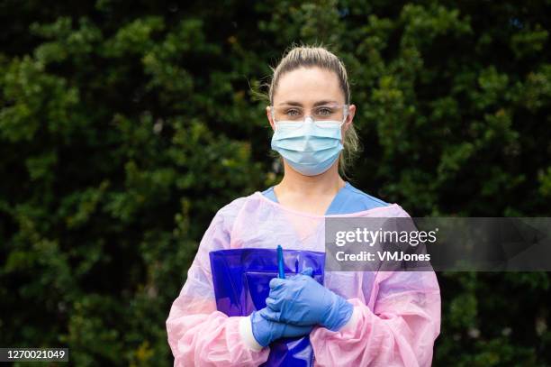 portrait of nurse wearing protective workwear outdoors - emergency services australia imagens e fotografias de stock