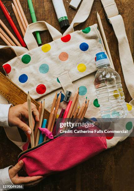 flat lay spotty schoolbag with stationary surrounding - canvas bag stock pictures, royalty-free photos & images