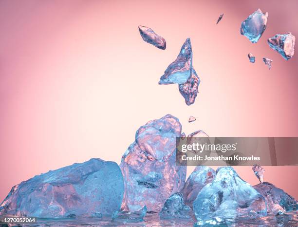 ice block exploding - destruction background stock pictures, royalty-free photos & images