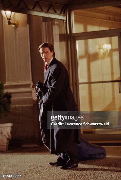 Christian Bale drags a body in a bag out of a building on West End Avenue on the upper west side of Manhattan for a scene for "American Psycho." I...