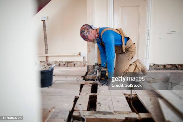 repairing floorboards during renovation - floorboard stock pictures, royalty-free photos & images