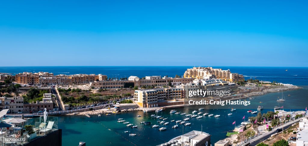St George's Bay in Paceville St Julian's Malta. Showing Apartments, Hotels and boats in the harbour waterfront