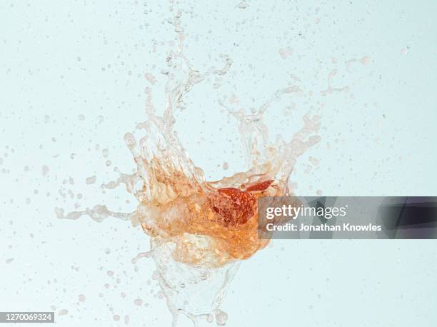 strawberries exploding in liquid - sparkling wine stock pictures, royalty-free photos & images