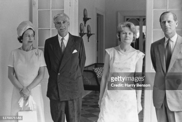 Queen Elizabeth II and Prince Philip, Duke of Edinburgh pose with Lord and Lady Avon during a visit to Bridgetown, Barbados on their Caribbean Tour,...