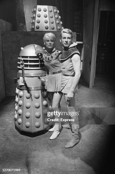 Actors Suzanne Mockler and Nicholas Bennet star in the play 'Curse of the Daleks' at Wyndham's Theatre in London, UK, December 1965. The play was...