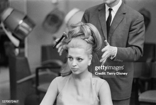 Socialite, actress and designer Ira von Fürstenberg has her hair done, 30th June 1966.
