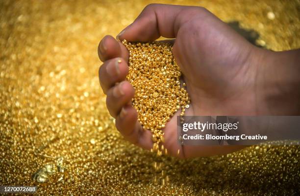 gold grain - granule stock pictures, royalty-free photos & images