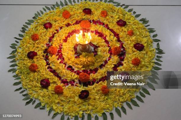 onam pookalam/onam celebration/floral pattern-kerala festival - pookalam stock pictures, royalty-free photos & images