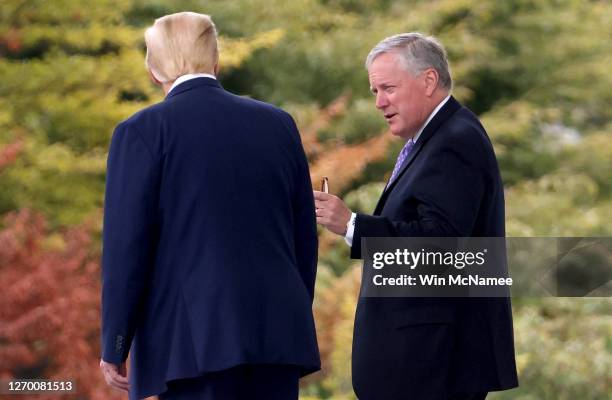 President Donald Trump confers with White House Chief of Staff Mark Meadows while departing the White House September 1, 2020 in Washington, DC....