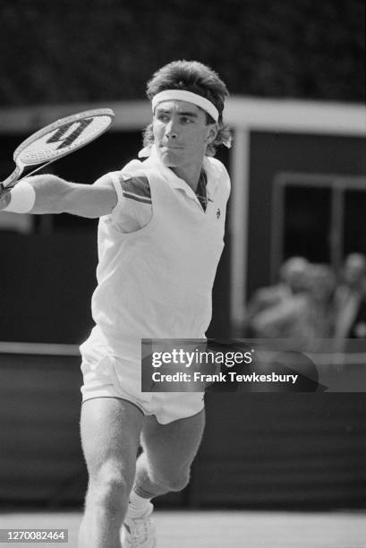Australian tennis player Pat Cash in action against Peter Doohan in the Stella Artois Championships at the Queen's Club in London, 10th June 1985.