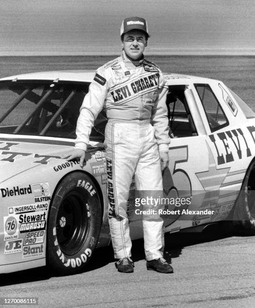 Driver Geoff Bodine stands beside his race car prior to the start of the 1987 Daytona 500 stock car race at Daytona International Speedway in Daytona...