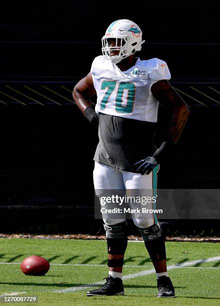 Julie'n Davenport of the Miami Dolphins looks on during training camp at Baptist Health Training Facility at Nova Southern University on September...