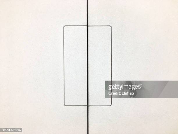 the rectangle on the white wall is divided by straight lines - split screen ストックフォトと画像
