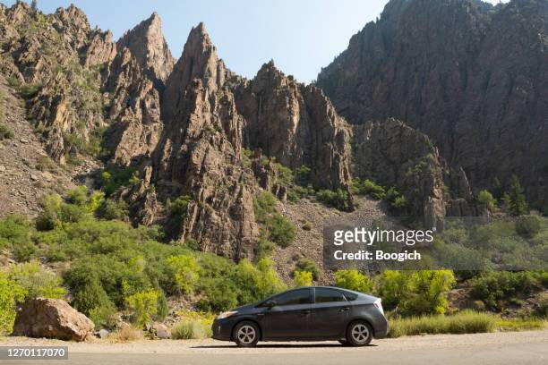 toyota prius hybrid car on road trip parked in scenic colorado usa - toyota prius stock pictures, royalty-free photos & images