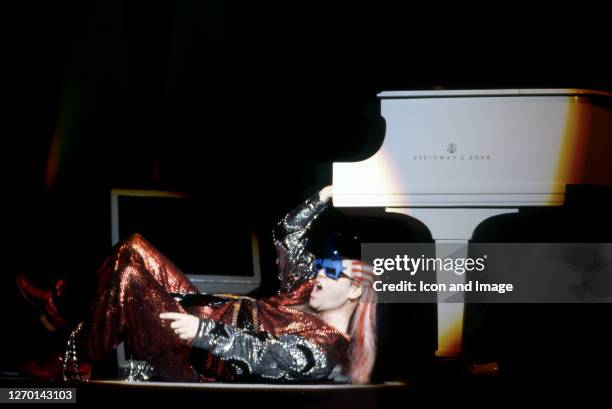 English singer, songwriter, pianist and composer, Sir Elton John, performs at Pine Knob Music Theatre during his "Ice on Fire Tour," on August 17 in...