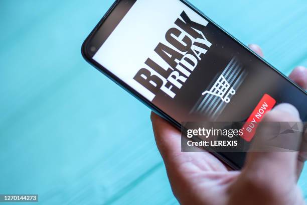 mobile application for online shopping black friday - black friday fotografías e imágenes de stock