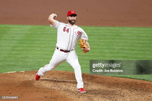 Designated hitter Matt Davidson of the Cincinnati Reds pitches in the eighth inning against the St. Louis Cardinals at Great American Ball Park on...