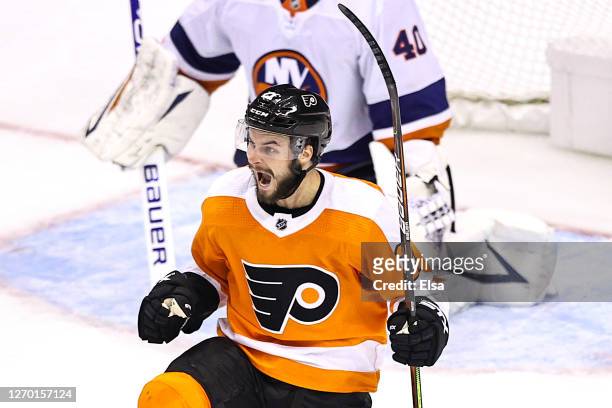 Scott Laughton of the Philadelphia Flyers celebrates after scoring the game-winning goal against the New York Islanders during the first overtime...