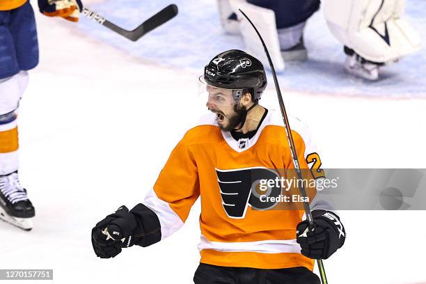 Scott Laughton of the Philadelphia Flyers celebrates after scoring the game-winning goal against the New York Islanders during the first overtime...