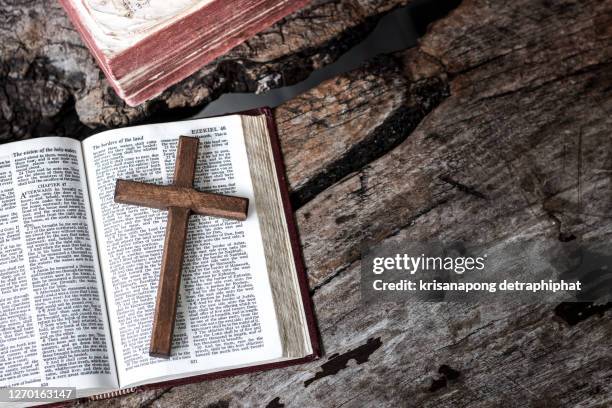 the holy bible,bible,reading,book - open bible on table stock pictures, royalty-free photos & images