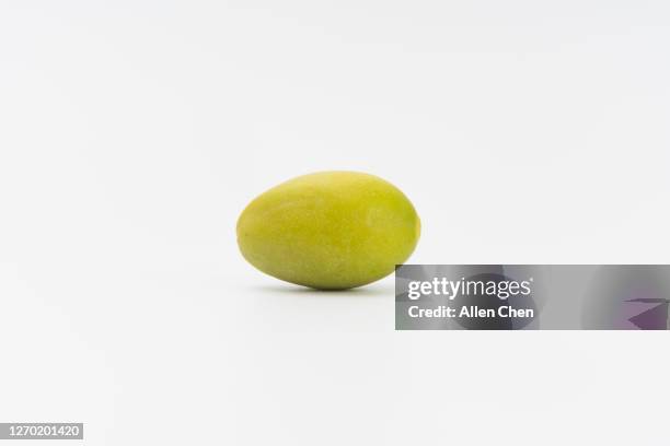 one olive on white background - olive isolated stock pictures, royalty-free photos & images