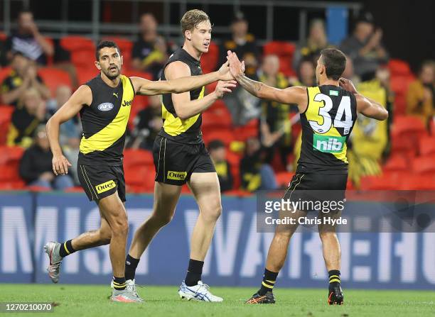 Tom J. Lynch of the Tigers celebrates after scoring a goal during the round 15 AFL match between the Richmond Tigers and the Fremantle Dockers at...