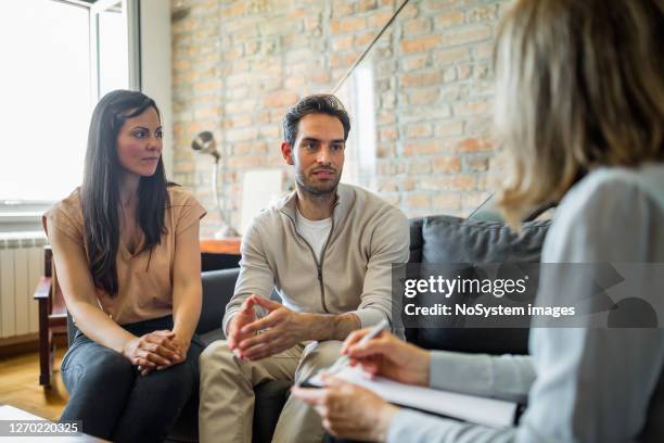 young couple on a therapy - couple counselling stock pictures, royalty-free photos & images