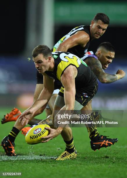 Kamdyn McIntosh of the Tigers competes for the ball during the round 15 AFL match between the Richmond Tigers and the Fremantle Dockers at Metricon...
