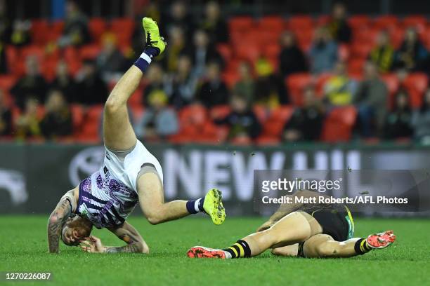 Nathan Wilson of the Dockers competes for the ball against Trent Cotchin of the Tigers during the round 15 AFL match between the Richmond Tigers and...