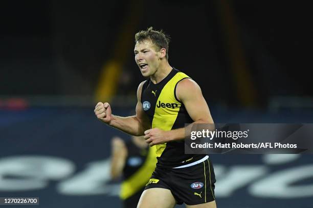 Jake Aarts of the Tigers celebrates kicking a goal during the round 15 AFL match between the Richmond Tigers and the Fremantle Dockers at Metricon...