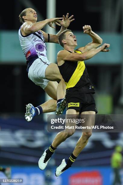 Nat Fyfe of the Dockers competes for the ball against Thomson Dow during the round 15 AFL match between the Richmond Tigers and the Fremantle Dockers...